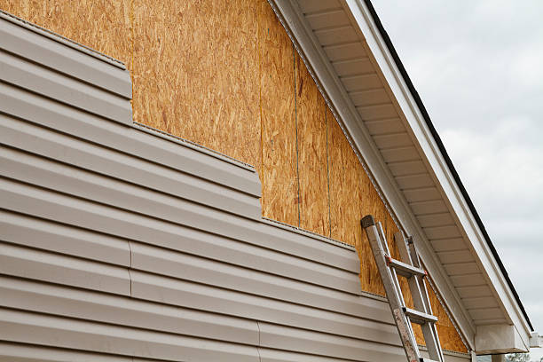 Professional Emergency Siding Repair technician working in Acton, MA